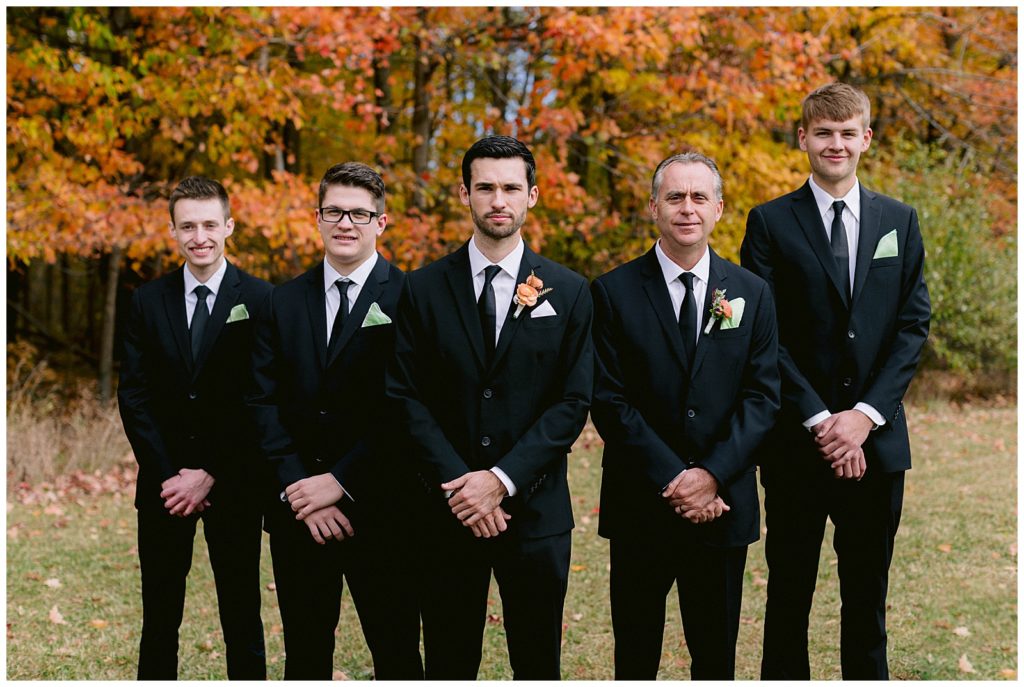 Groomsmen pose for a photo before the wedding ceremony.