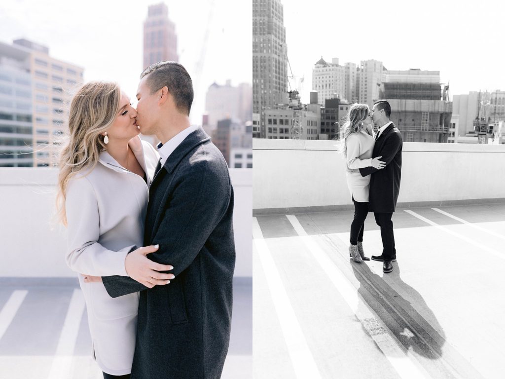 engaged couple kisses detroit rooftop engagement