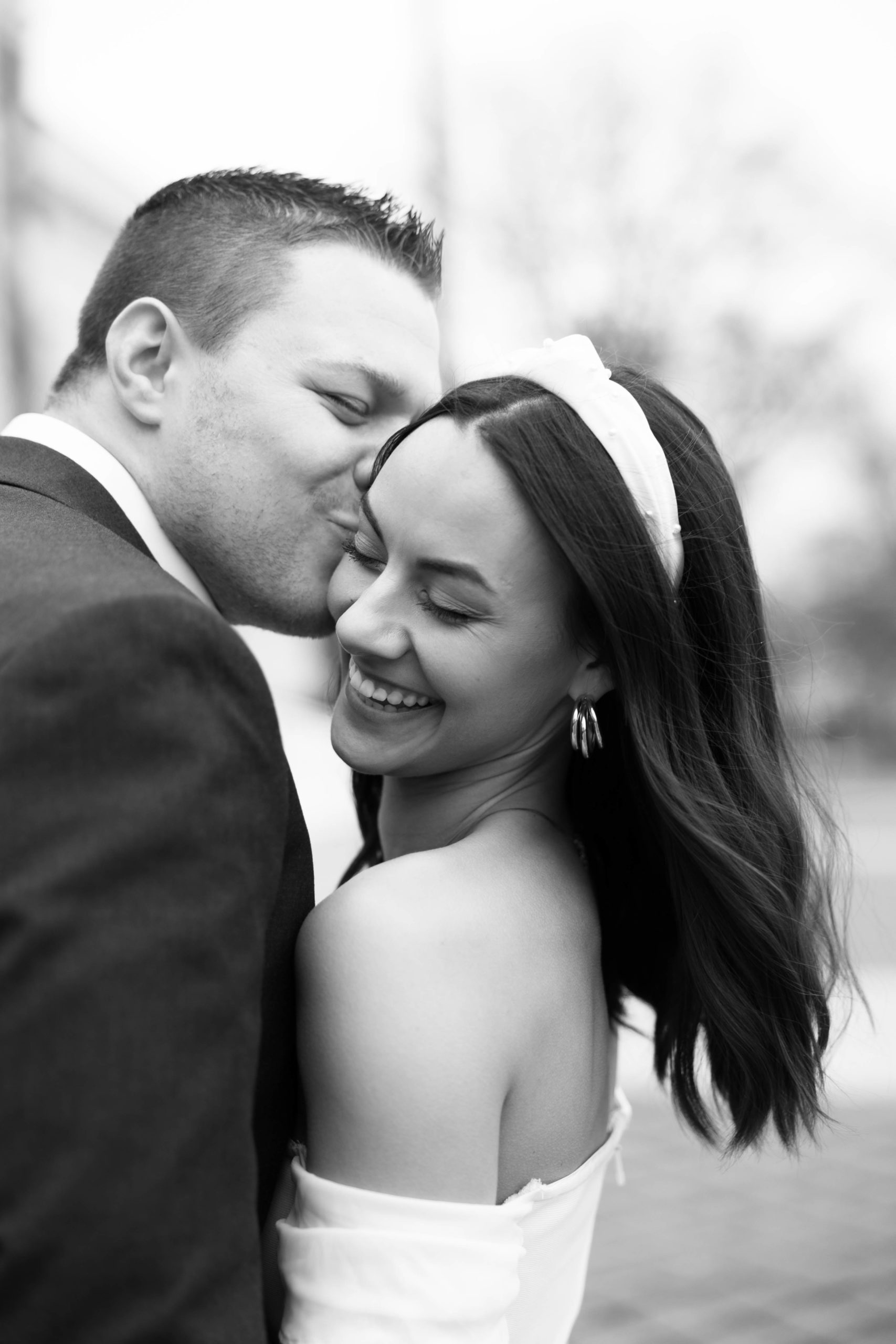 engaged fiance kisses partner in detroit