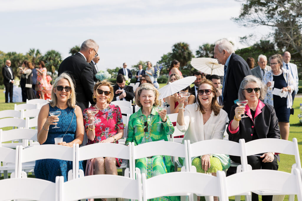 guests sitting with champagne wedding ceremony